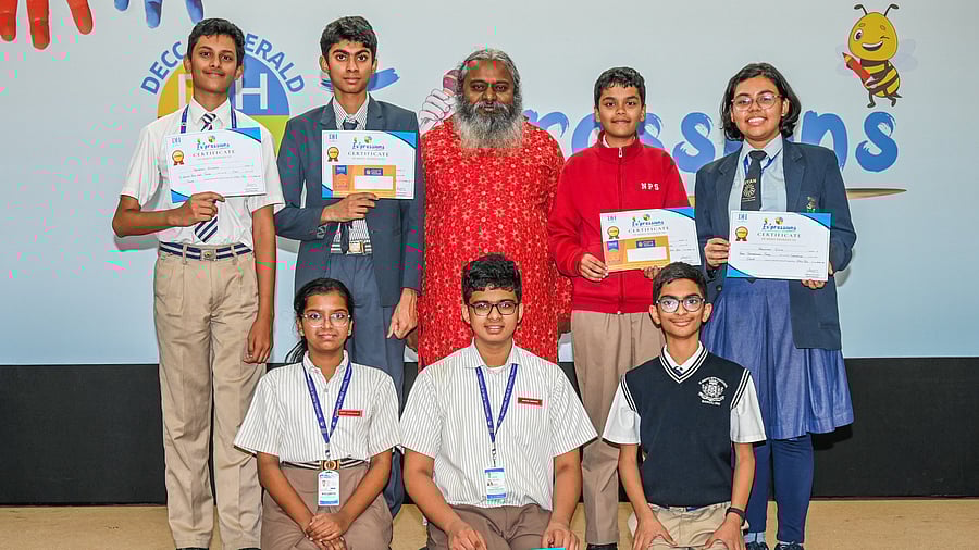 <div class="paragraphs"><p>Arul Mani, Dean of the School of Languages at St Joseph's University, with the winners of the Spell&nbsp;Bee&nbsp;competition. </p></div>
