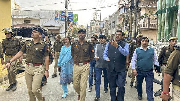 <div class="paragraphs"><p>Police and security personnel during a flag march near the Shahi Jama Masjid, in Sambhal, on Friday.</p></div>