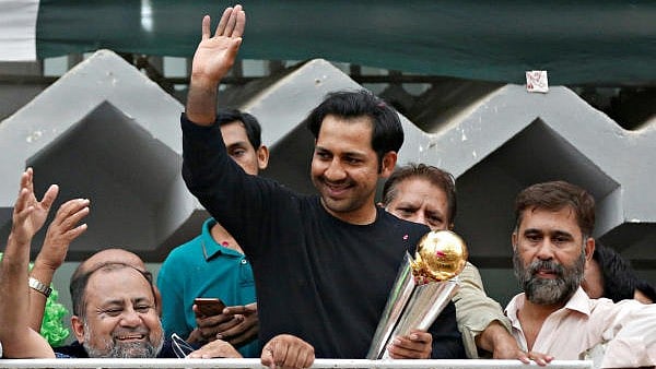 <div class="paragraphs"><p>(File Photo) Pakistan's Sarfraz Ahmed gestures to cricket fans as he celebrates winning the ICC Champions Trophy upon his arrival at his house in Karachi</p></div>