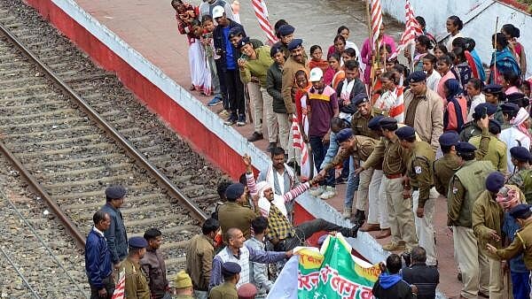 <div class="paragraphs"><p>File Photo showing tribal workers during their protest as they arrive to block the railway lines, demanding the implemention of the 'Sarna Code', in Ranchi</p></div>