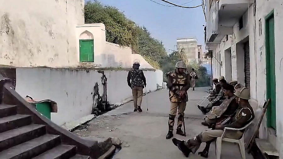 <div class="paragraphs"><p>Police and security personnel stand guard near the premises of Shahi Jama Masjid </p></div>