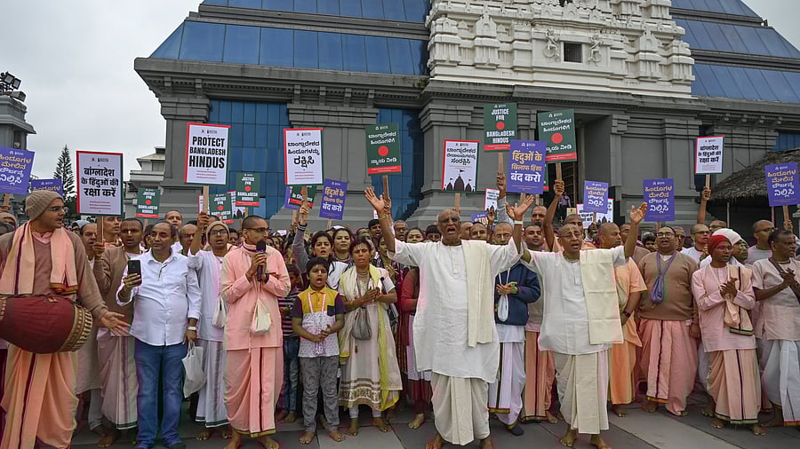 <div class="paragraphs"><p>Devotees perform 'sankeerthana', praying for the protection of minorities in Bangladesh, at the Iskcon temple in Rajajinagar, on Sunday.&nbsp;</p></div>