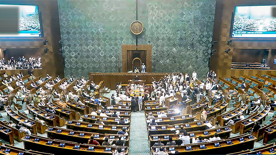 <div class="paragraphs"><p>Opposition members protest in the Lok Sabha during the Winter session of Parliament, in New Delhi.</p></div>