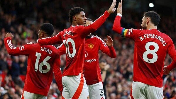 <div class="paragraphs"><p>Manchester United's Marcus Rashford celebrates scoring their third goal with Bruno Fernandes and teammates.</p></div>