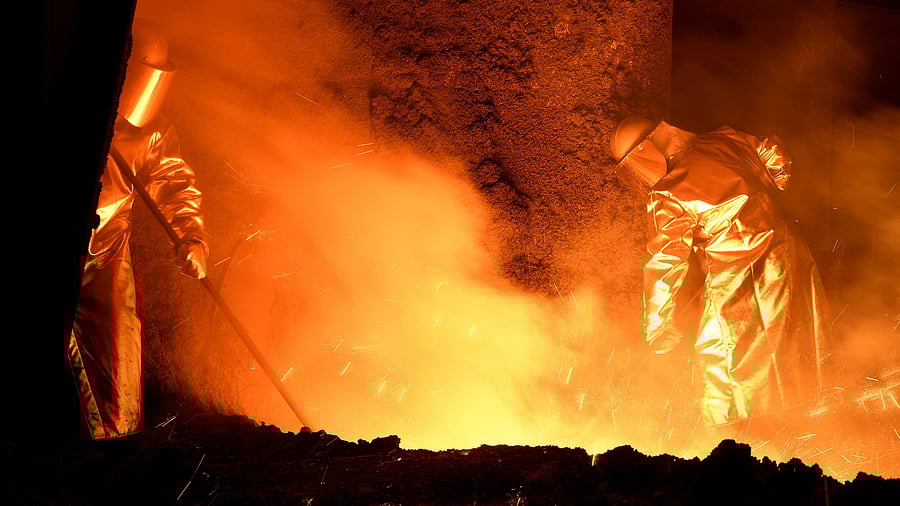<div class="paragraphs"><p>Steelworkers stand at a furnace at the plant of a steel company. (Image for representation)</p></div>