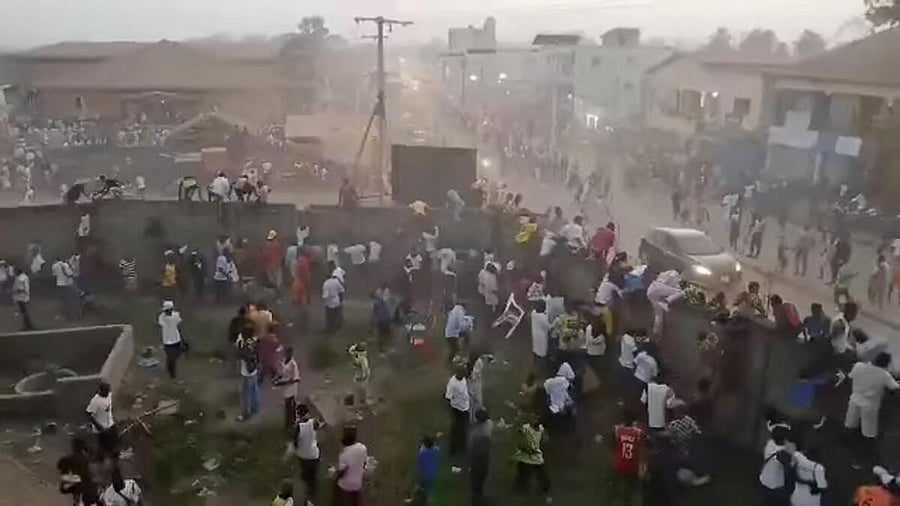 <div class="paragraphs"><p>People scramble in Nzerekore, Guinea, where local officials said a deadly stampede ensued at a stadium following fan clashes during a football match</p></div>