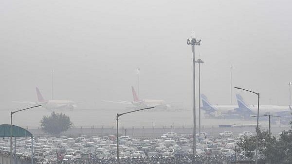 <div class="paragraphs"><p>File Photo of Indira Gandhi International Airport enveloped in smog on a winter day, in New Delhi.</p></div>