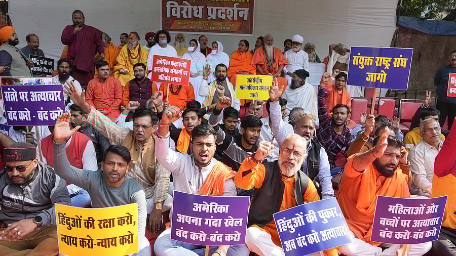 <div class="paragraphs"><p>New Delhi: People raise slogans during a protest organised by Vishva Hindu Parishad (VHP) against the atrocities on religious minorities in Bangladesh, in New Delhi, Monday, Dec 2, 2024. </p></div>
