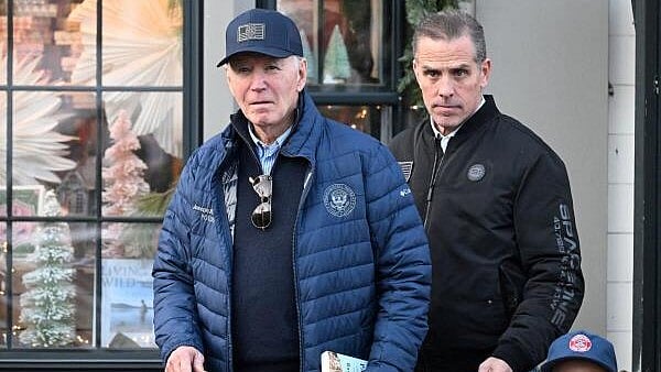 <div class="paragraphs"><p>US President Joe Biden, accompanied by Hunter Biden</p></div>