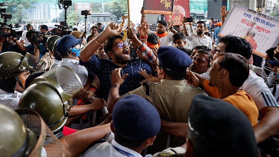 <div class="paragraphs"><p>In this file image,&nbsp;Hindu activists try to break a police barricade in Kolkta as they protest demanding the release of jailed Hindu monk leader Chinmoy Krishna Das Brahmachari.&nbsp;</p></div>