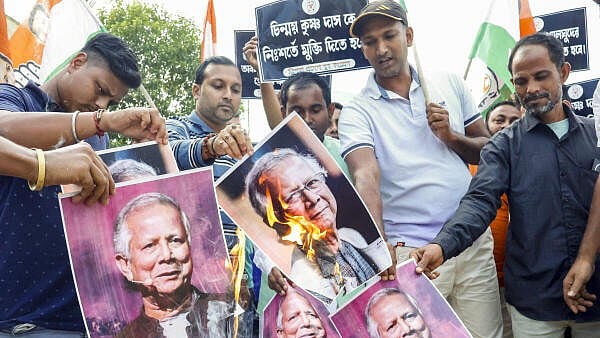 <div class="paragraphs"><p> Members of Tripura Congress stage a protest against Chief Adviser of Bangladesh Muhammad Yunus demanding the release of spiritual leader Chinmoy Krishna Das who was arrested in the neighbouring country, in Agartala.</p></div>