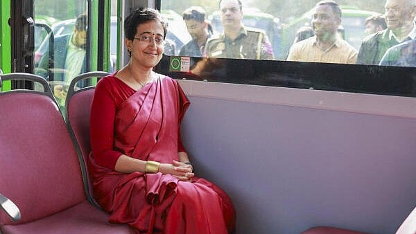 <div class="paragraphs"><p>Delhi Chief Minister Atishi aboard a Mohalla bus during her visit to Kushak Nala depot to inspect 150 Mohalla buses and their charging infrastructure, in New Delhi, Tuesday, Dec. 3, 2024. The buses will soon be operational in the congested areas of the national capital.</p></div>
