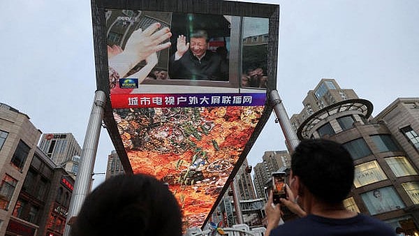 <div class="paragraphs"><p>A giant screen shows news footage of Chinese President Xi Jinping visiting Xinjiang Uyghur Autonomous Region, at a shopping centre, in Beijing, China.&nbsp;</p></div>