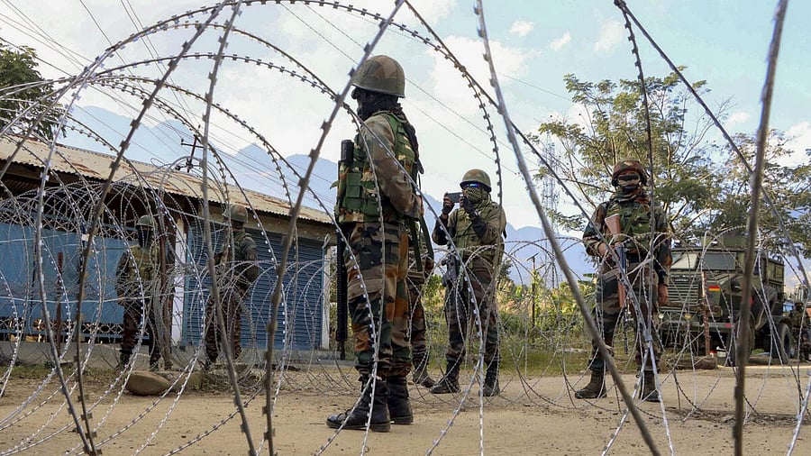 <div class="paragraphs"><p>Security personnel stand guard during a protest in Manipur. </p></div>