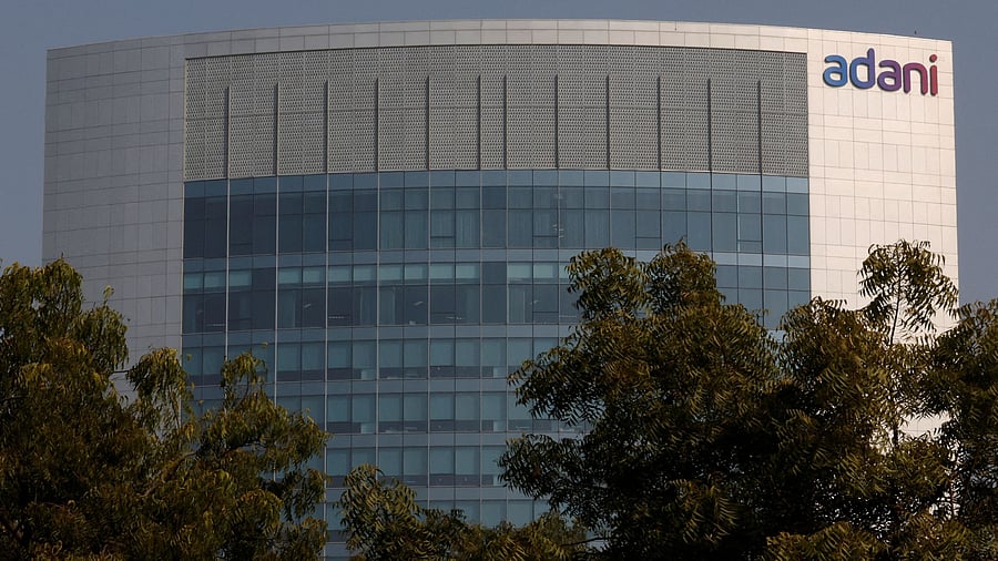 FILE PHOTO: The logo of the Adani Group is seen on the facade of its Corporate House on the outskirts of Ahmedabad, India, November 22, 2024. REUTERS/Amit Dave/File Photo
