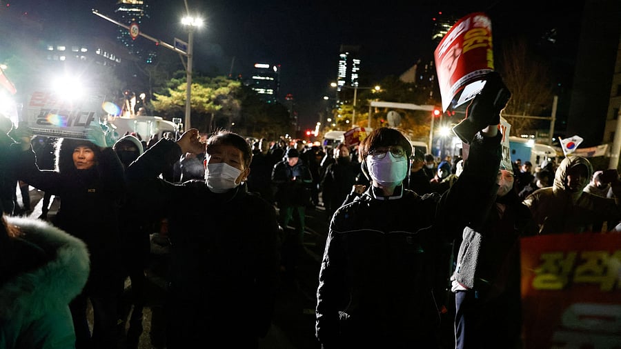 <div class="paragraphs"><p>People react outside National Assembly, after South Korean President Yoon Suk Yeol announced that he will lift the martial law, following parliamentary vote, in Seoul, South Korea.</p></div>