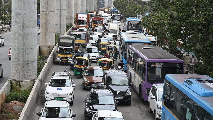 <div class="paragraphs"><p>Slow moving traffic on Marathahalli-Sarjapur Outer Ring Road on Tuesday. </p></div>