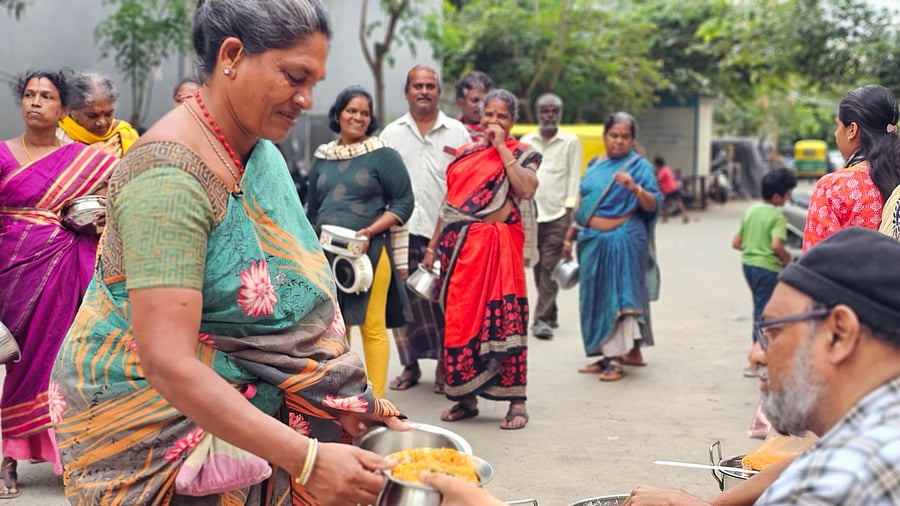 A food distribution drive by Helping Heroes India Foundation at a slum in J P Nagar.