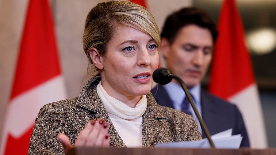 <div class="paragraphs"><p>Canada's Minister of Foreign Affairs Melanie Joly, with Prime Minister Justin Trudeau in the background.&nbsp;</p></div>