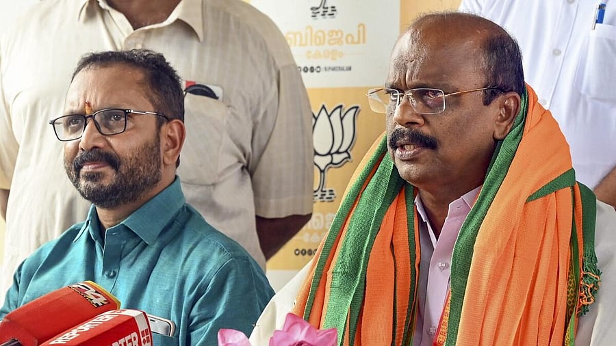 <div class="paragraphs"><p>Kerala BJP President K Surendran with newly joined party leader Madhu Mullassery during a press conference.</p></div>