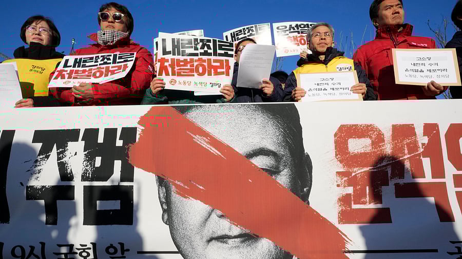 <div class="paragraphs"><p>Protesters stage a rally to demand South Korean President Yoon Suk Yeol to step down in front of the National Assembly in Seoul, South Korea, Wednesday, Dec. 4, 2024. The signs read "Punish."  </p></div>