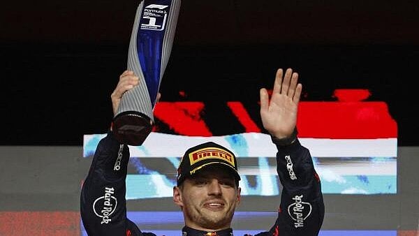 <div class="paragraphs"><p>Qatar Grand Prix - Lusail International Circuit, Lusail, Qatar - December 1, 2024 Red Bull's Max Verstappen celebrates with a trophy on the podium after winning the Qatar Grand Prix.</p></div>