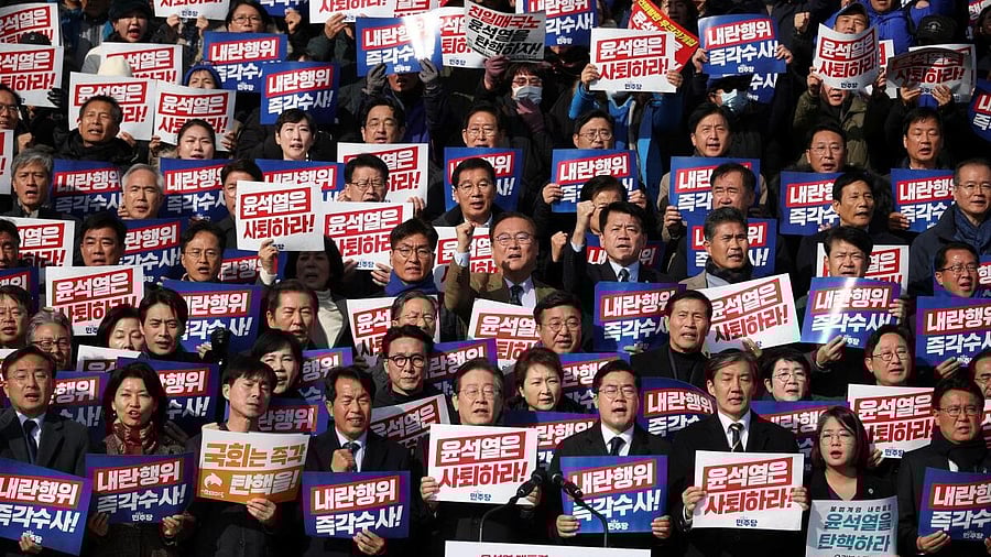 <div class="paragraphs"><p>South Korea's main opposition Democratic Party leader Lee Jae-myung, lawmakers and people attend a rally to condemn South Korean President’s surprise declarations of the martial law last night and to call for his resignation, at the national assembly in Seoul, South Korea, December 4, 2024.</p></div>