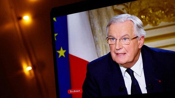 <div class="paragraphs"><p>A screen displays French Prime Minister Michel Barnier as he talks during an interview on French television after he used article 49.3, a special clause in the French Constitution, to push the budget bill through the National Assembly without a vote by lawmakers, and while members of parliament will be called tomorrow to vote on two motions of no-confidence against the French government, at the Hotel Matignon in Paris, France.</p></div>