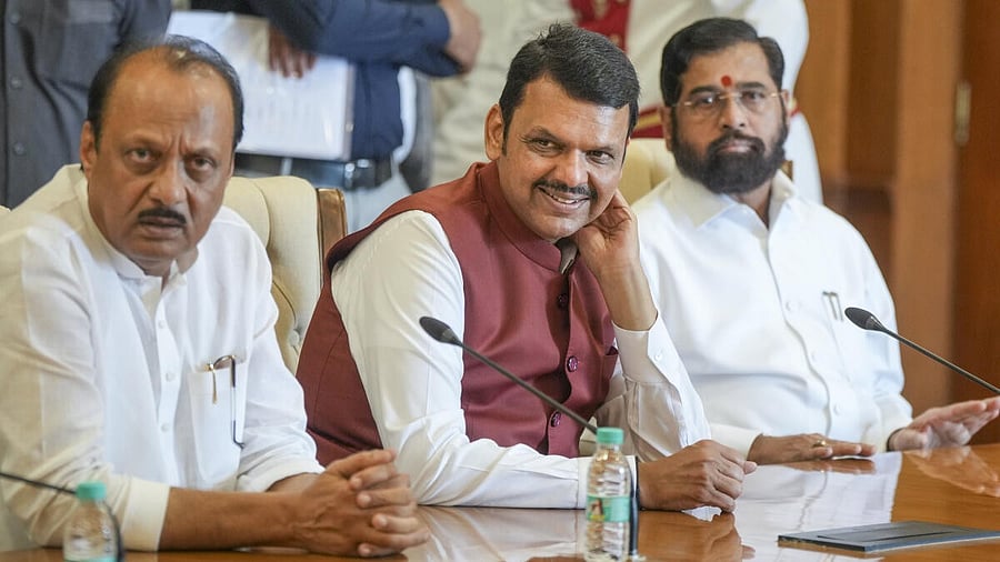 <div class="paragraphs"><p>Devendra Fadnavis, flanked by Ajit Pawar (left) and Eknath Shindre address a joint press conference in Mumbai. </p></div>