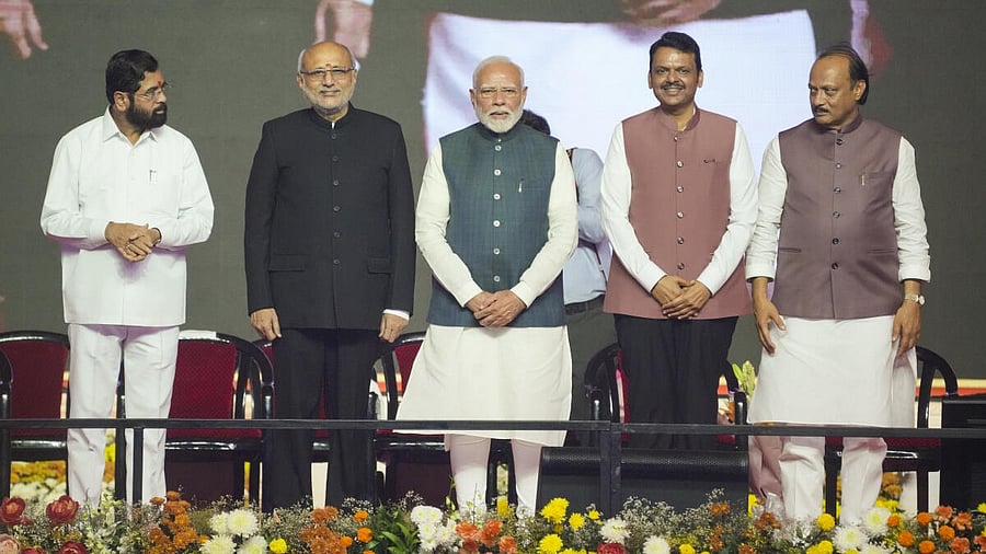 <div class="paragraphs"><p>Prime Minister Narendra Modi and Maharashtra Governor CP Radhakrishnan with the newly sworn Maharashtra Chief Minister Devendra Fadnavis and Deputy Chief Ministers Eknath Shinde and Ajit Pawar during the swearing-in ceremony, in Mumbai</p></div>