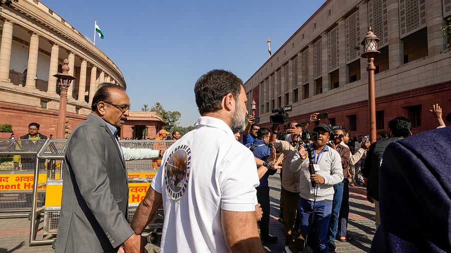 <div class="paragraphs"><p>Leader of Opposition in the Lok Sabha Rahul Gandhi with Marumalarchi Dravida Munnetra Kazhagam party (MDMK) MP Vaiko and other opposition MPs stage a protest during the Winter session of Parliament, in New Delhi, Thursday, Dec. 5, 2024. In an unusual protest, leaders of several I.N.D.I.A. bloc parties wore black jackets with stickers reading "Modi Adani Ek Hai" and "Adani Safe Hai" on them and raised slogans on the Parliament premises to demand a joint parliamentary probe into the Adani issue.</p></div>