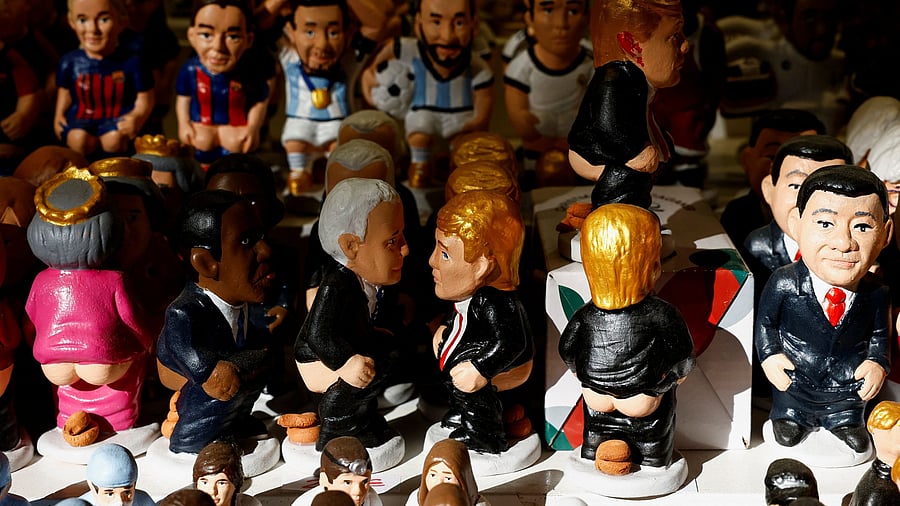 <div class="paragraphs"><p>Catalan traditional figurines "caganers" , which symbolise defecation and fertilisation of the earth and are believed to bring prosperity and luck for the coming year, including ones representing U.S. President-elect Donald Trump and U.S. President Biden, are displayed in a stall, at a Christmas market in Barcelona, Spain</p></div>