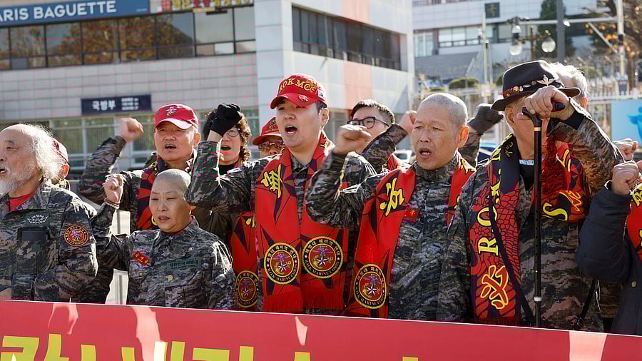 <div class="paragraphs"><p>South Korean marine veterans hold a rally demanding South Korean President Yoon Suk Yeol's removal from power, in front of the presidential office, in Seoul, South Korea, December 5, 2024. </p></div>