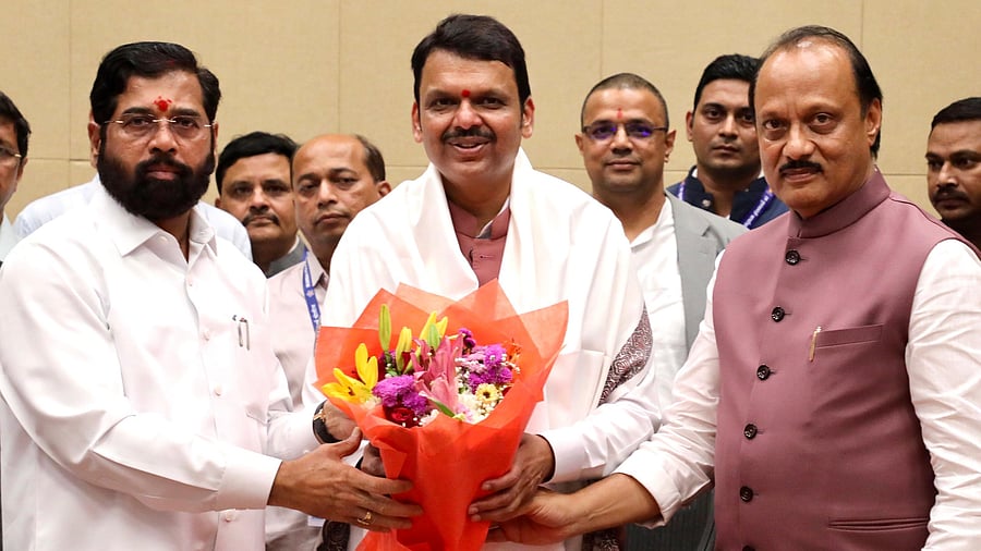 <div class="paragraphs"><p>Maharashtra CM Devendra Fadnavis is flanked by Eknath Shinde (left) and Ajit Pawar after the swearing-in ceremony in Mumbai. </p></div>