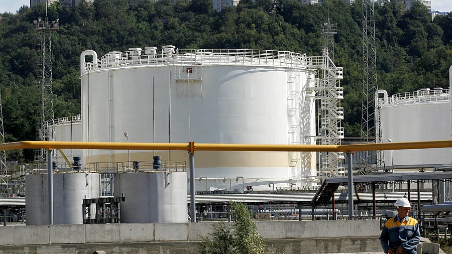 <div class="paragraphs"><p>File photo of a worker in front of storage tanks at the Rosneft oil refinery in Tuapse at the Russian Black Sea coast. </p></div>