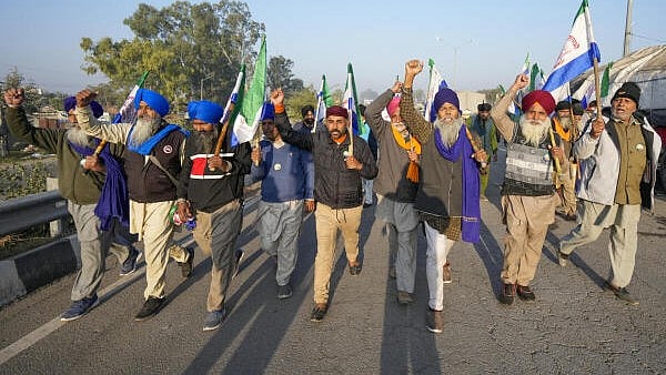 <div class="paragraphs"><p>Farmers raise slogans as they gather at Shambhu border ahead of their 'Delhi Chalo' march to the national capital, in Patiala district, Punjab.</p></div>