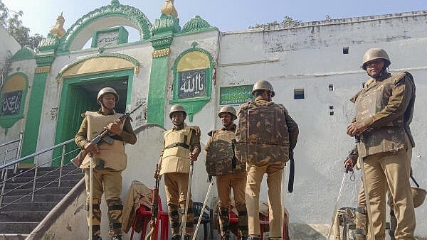 <div class="paragraphs"><p>Police and security personnel stand guard outside the Shahi Jama Masjid amid Friday prayers, in Sambhal, Uttar Pradesh</p></div>