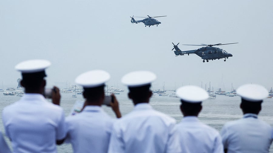 <div class="paragraphs"><p>Indian Navy personnel watch a demonstration during Navy Day celebrations in Mumbai, India,.</p></div>