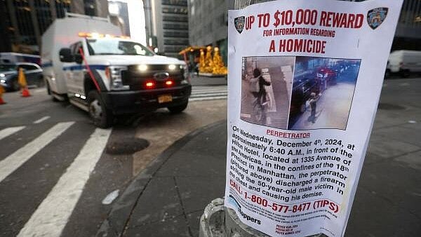 <div class="paragraphs"><p>A poster is attached to a lamp post outside the Hilton hotel near the scene where the CEO of UnitedHealthcare Brian Thompson was shot dead in Midtown Manhattan, in New York City, U.S., December 5, 2024.</p></div>