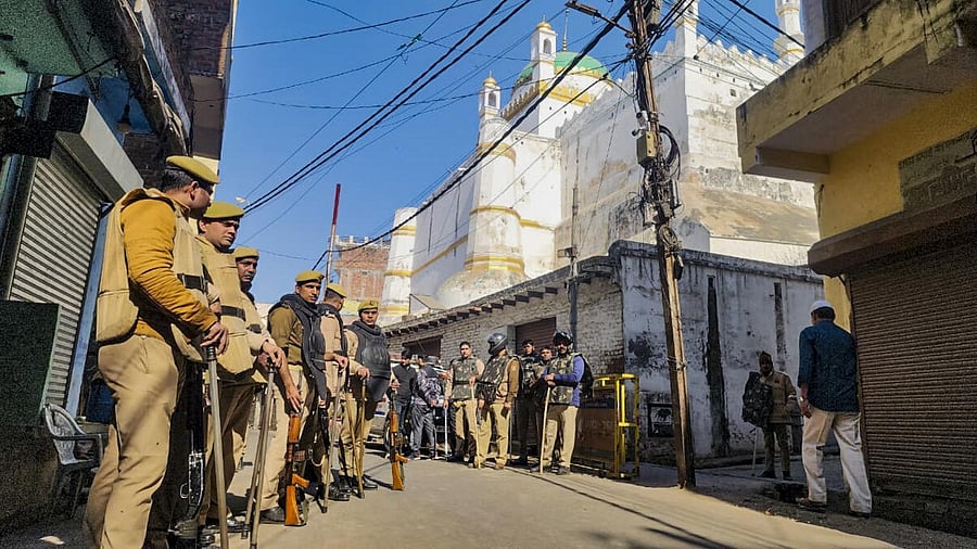 <div class="paragraphs"><p>Police and security personnel stand guard outside the Shahi Jama Masjid amid Friday prayers, in Sambhal, Friday, December 6, 2024. </p></div>