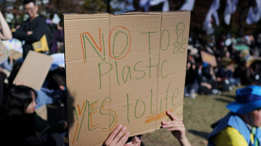<div class="paragraphs"><p>A woman holds up a sign during a rally to demand stronger global commitments to fight plastic waste at the upcoming fifth session of the Intergovernmental Negotiating Committee , in Busan, South Korea, November 23, 2024. </p></div>