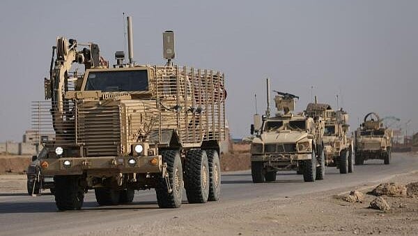 <div class="paragraphs"><p>US military vehicles drive in Hasaka, Syria December 6, 2024.</p></div>