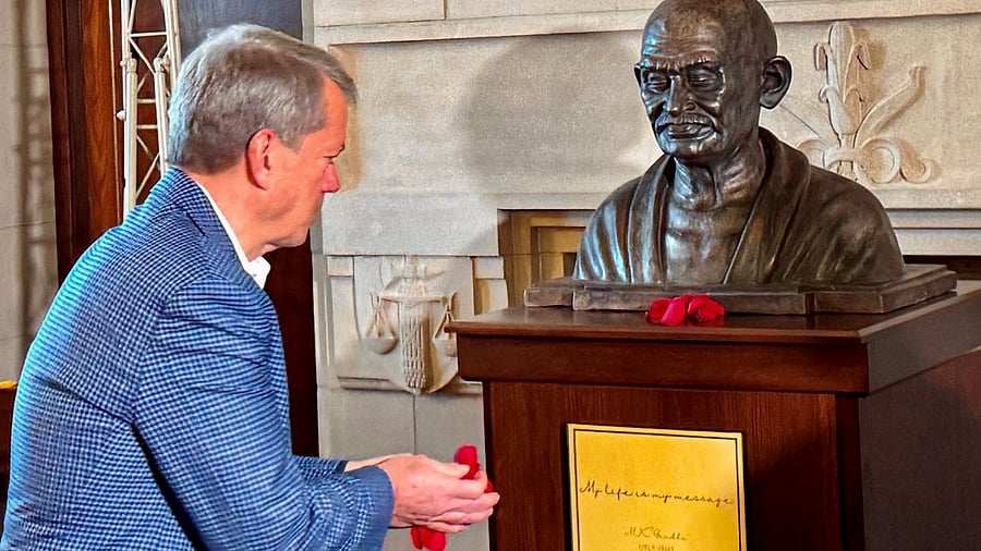 <div class="paragraphs"><p>Governor of Nebraska Jim Pillen pays tribute after unveiling a bust of Mahatma Gandhi at the Governors office on the Nebraska State Capitol premises, in Lincoln, Nebraska, USA, Friday, Dec. 6, 2024. </p></div>