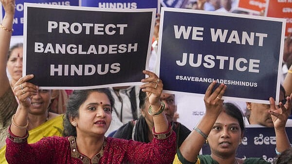 <div class="paragraphs"><p>People hold placards during a protest against the alleged atrocities on Hindus in Bangladesh. (Image for representation)</p></div>