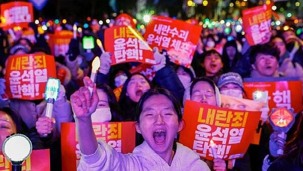 <div class="paragraphs"><p>Protesters chant slogans as they attend a rally calling for the impeachment of South Korean President Yoon Suk Yeol, who declared martial law, which was reversed hours later, in front of the National Assembly in Seoul, South Korea, December 7, 2024.</p></div>
