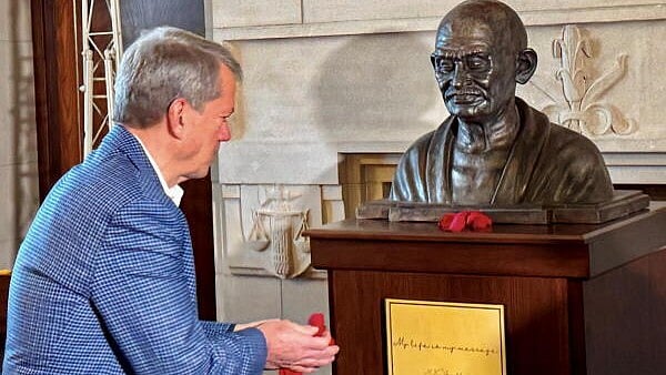 <div class="paragraphs"><p>Governor of Nebraska Jim Pillen pays tribute after unveiling a bust of Mahatma Gandhi at the Governor’s office on the Nebraska State Capitol premises, in Lincoln, Nebraska, USA, Friday, Dec. 6, 2024. </p></div>