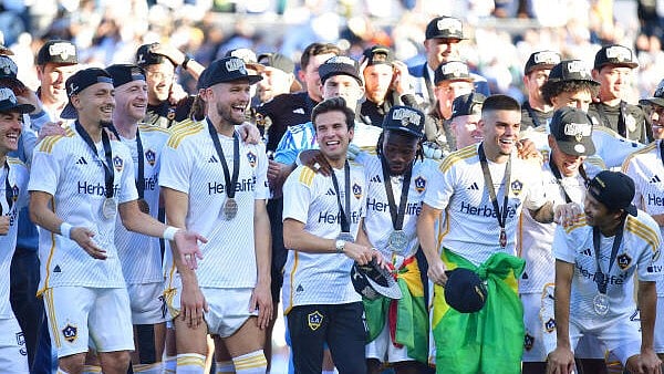 <div class="paragraphs"><p>Carson, California, USA: LA Galaxy midfielder Riqui Puig (10) and forward Joseph Paintsil (28) celebrate with teammates on the podium after defeating the New York Red Bulls in the 2024 MLS Cup at Dignity Health Sports Park. </p></div>