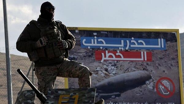 <div class="paragraphs"><p>A member of the Lebanese army stands on top of a military vehicle at Masnaa Border Crossing, after Syrian rebels announced that they have ousted President Bashar al-Assad, Lebanon, December 8, 2024.</p></div>
