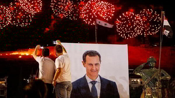 <div class="paragraphs"><p>Supporters of Syria's President Bashar al-Assad celebrate after the results of the presidential election announced that he won a fourth term in office, in Damascus.</p></div>