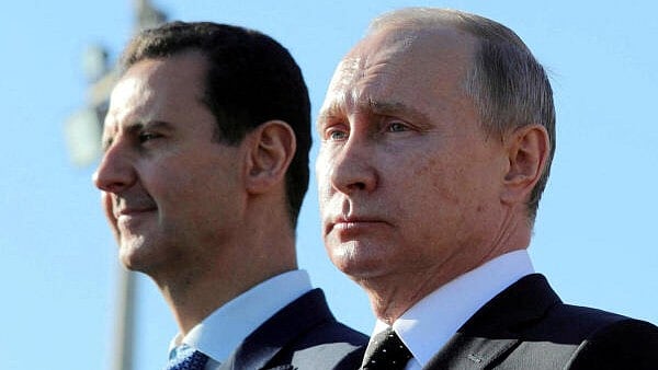 <div class="paragraphs"><p> Bashar al-Assad seen here with&nbsp;Russian President Putin who helped prop up his regime.</p></div>